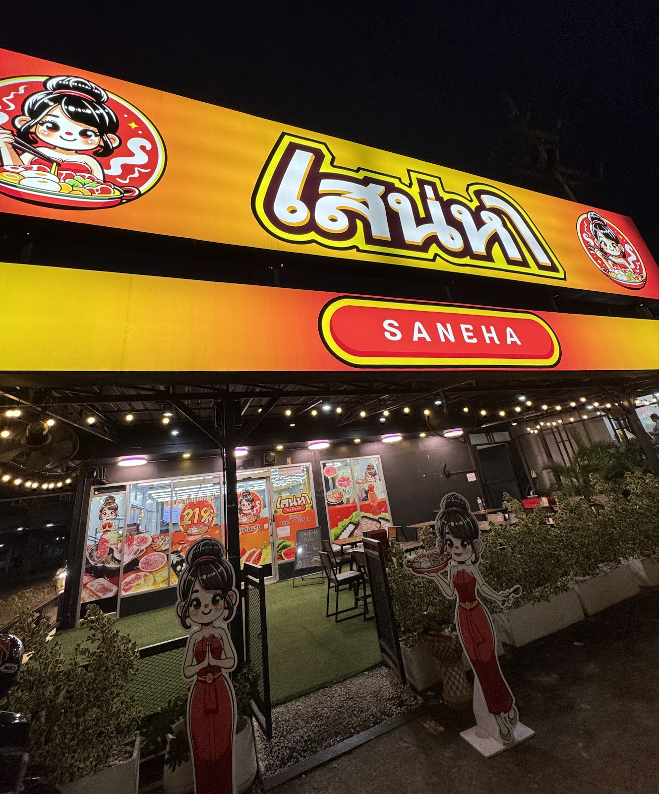 Illuminated Saneha Suki restaurant sign and entrance in Pattaya